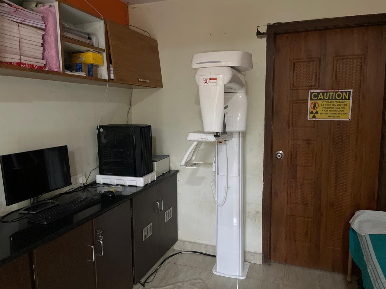 In-house OPG and CBCT diagnostic imaging equipment room at Krishna Sai Dental Care